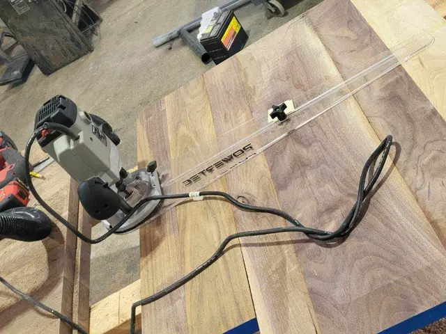 Walnut tabletop being cut to a precise circle with a track saw in Estacada, OR — Devine Home Remodeling & Construction