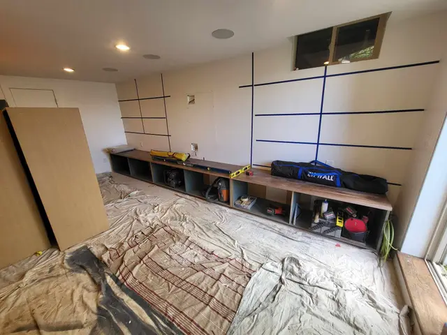 Custom base cabinet boxes installed along an entertainment wall in progress near Estacada, OR — Devine Home Remodeling & Construction