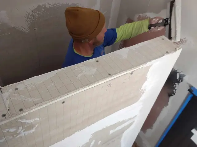 Cement board being installed inside a custom shower enclosure in Estacada, OR — Devine Home Remodeling & Construction