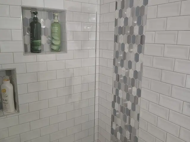 Custom shower niche and hex accent tile detail in a guest bathroom near Estacada, OR — Devine Home Remodeling & Construction